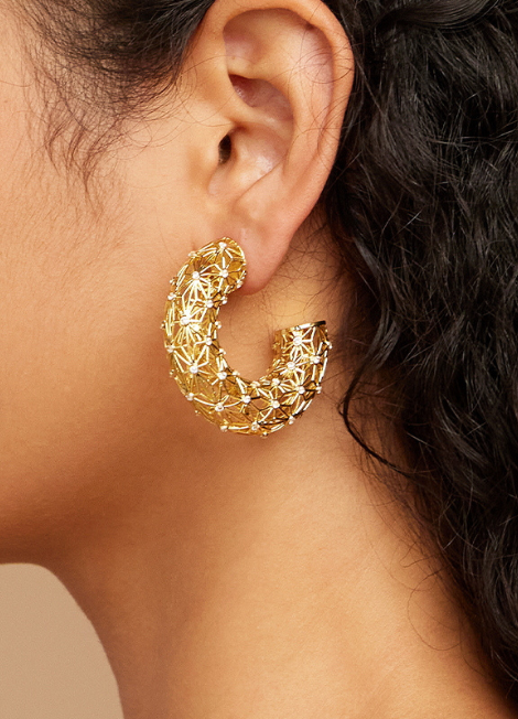 Claire Earrings feature a hollow design with shimmering zirconia, 18K gold-plated for a luxe glow. A bold favourite among Hong Kong trendsetters.