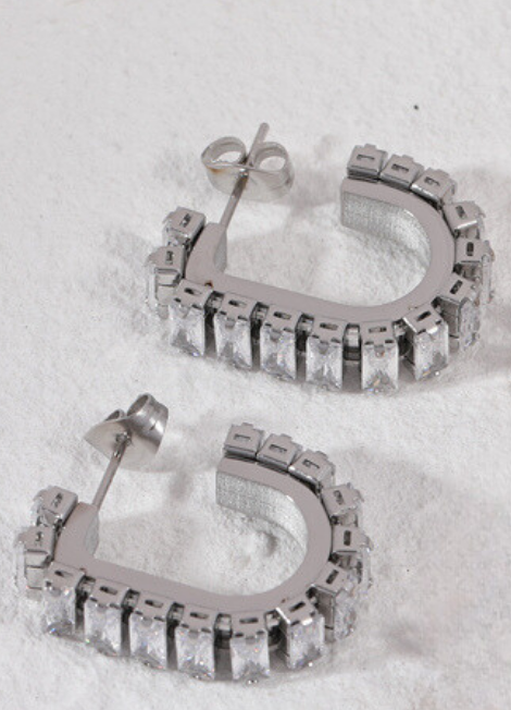 Dazzling silver-tone earrings with crystal pavé detailing, perfect for adding a touch of sparkle to any outfit.