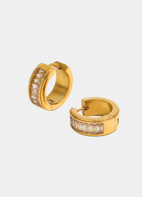 Gold-plated huggie earrings with pavé-set zirconia stones, offering a refined and luxurious sparkle.